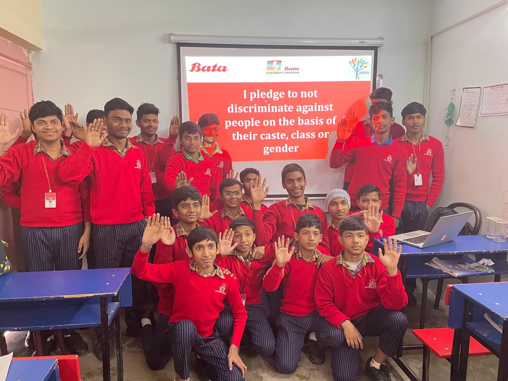 Adolescent boys taking a pledge against caste, class, and gender discrimination during a Janman positive masculinity workshop